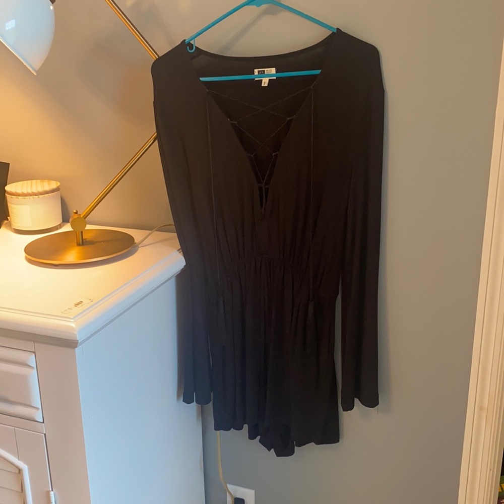 Black long sleeve romper. Tassel strings!